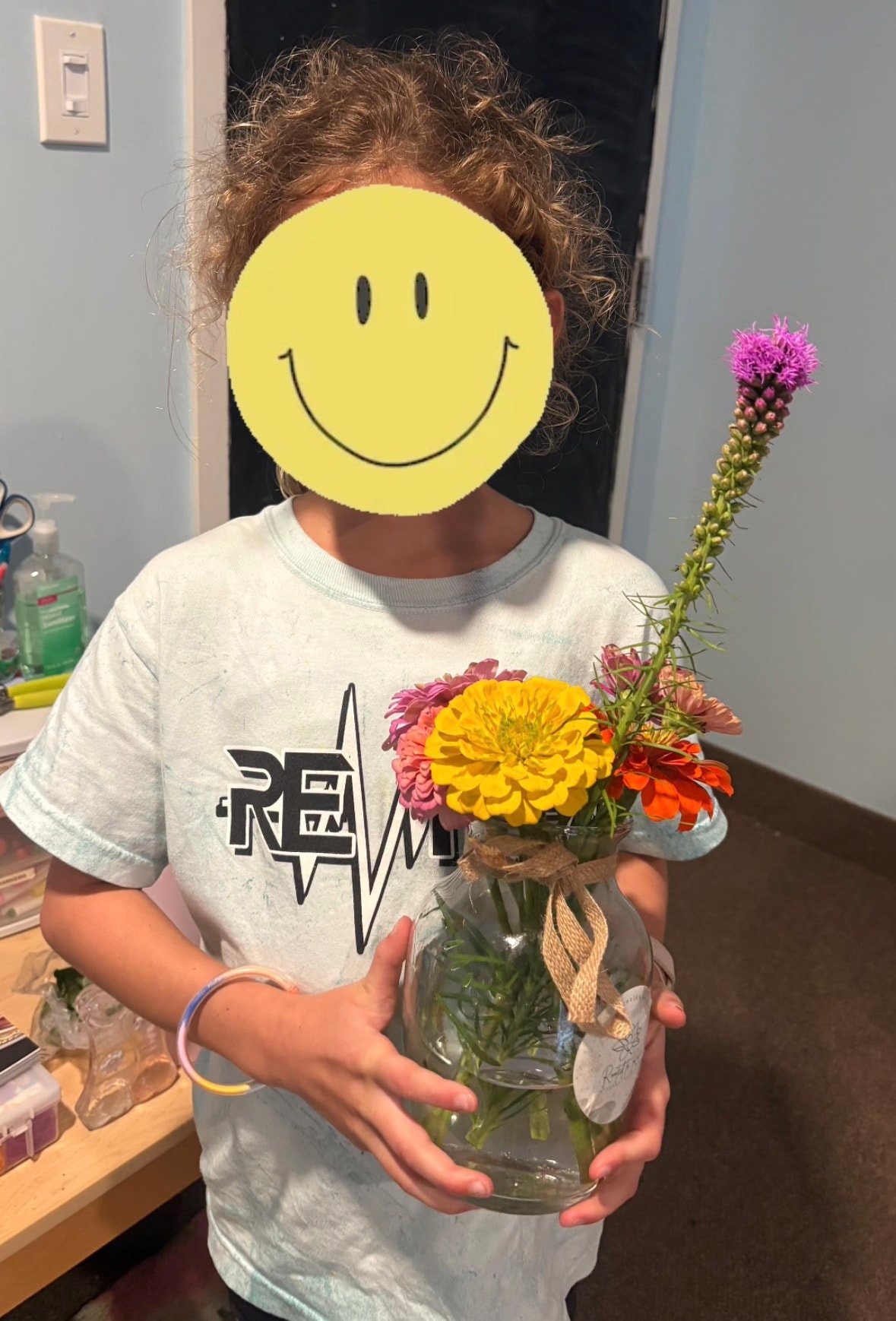 Person holding colorful flowers