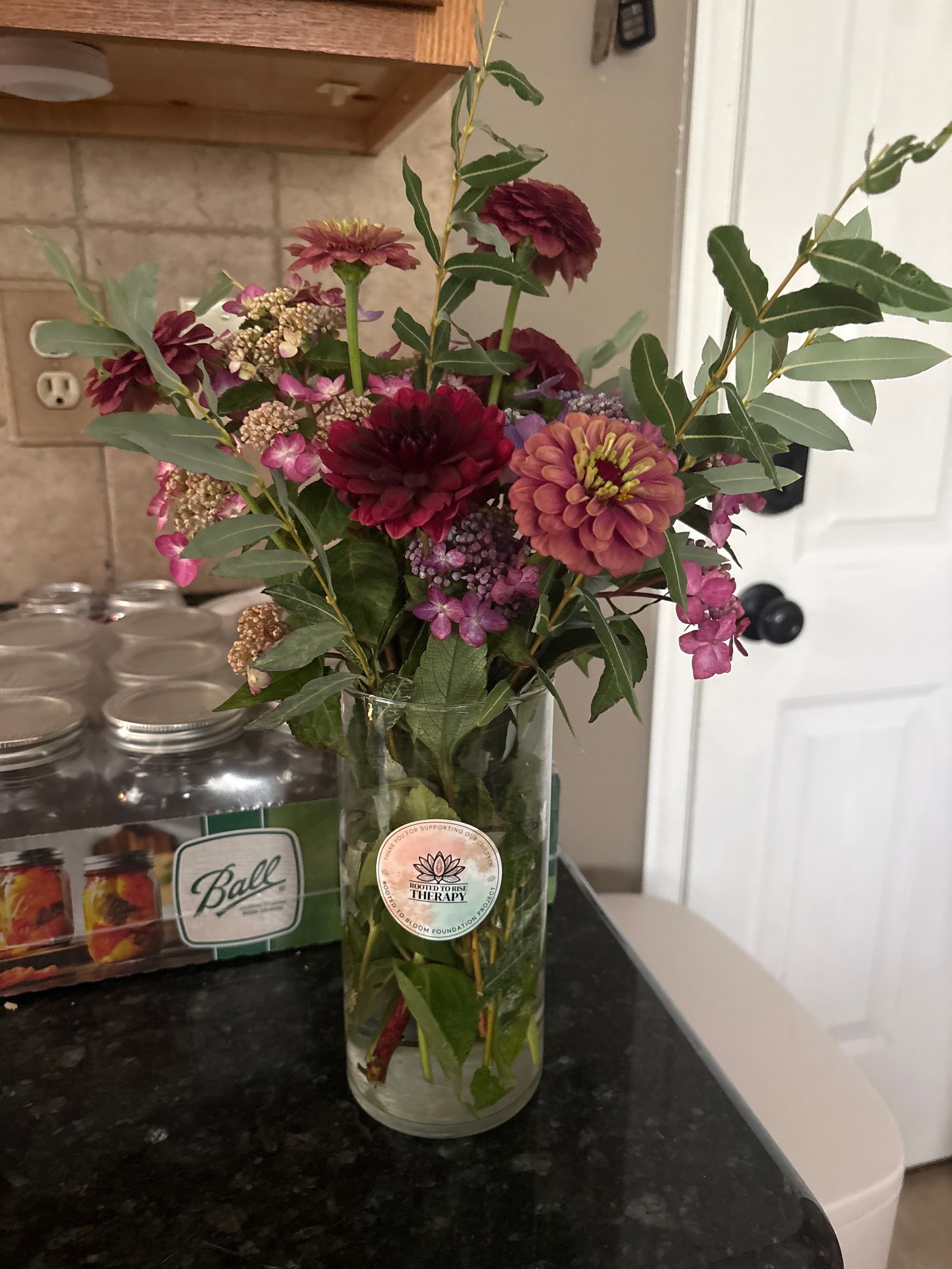 Burgundy dahlias and mixed flowers